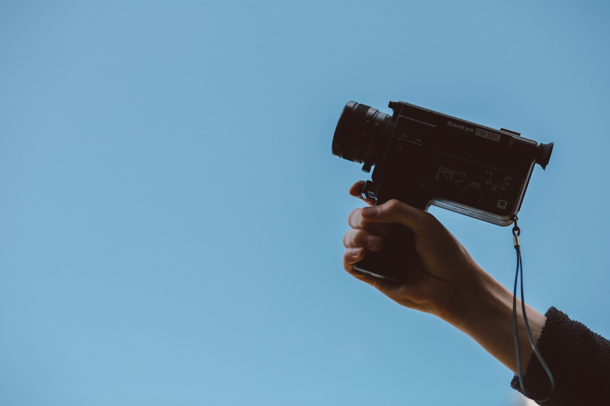 10 Best Budget Cameras For Filmmaking in 2019 - An image of someone holding a vintage camcorder