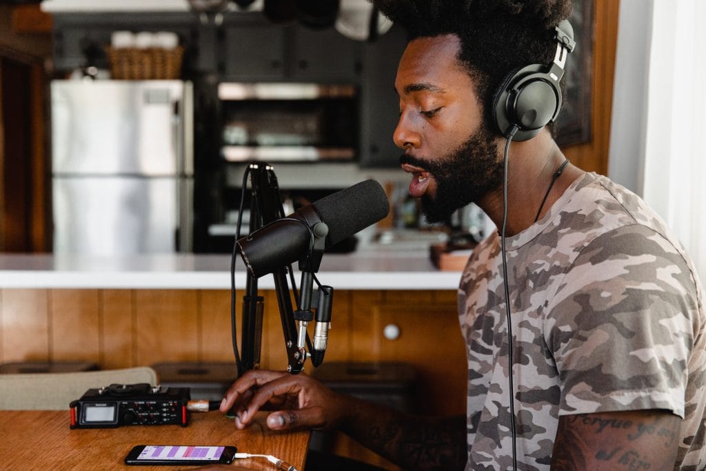 What is Royalty Free Music? - Man singing into a microphone