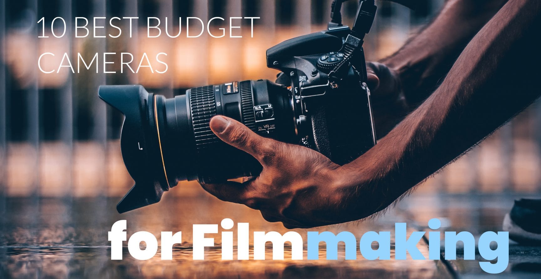 Best budget cameras for filmmaking - man holding camera