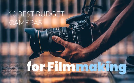 Best budget cameras for filmmaking - man holding camera