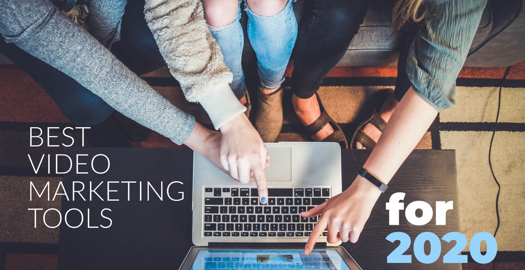 best video marketing tools 2020 - girls pointing at laptop