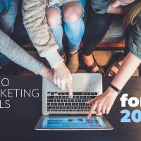best video marketing tools 2020 - girls pointing at laptop