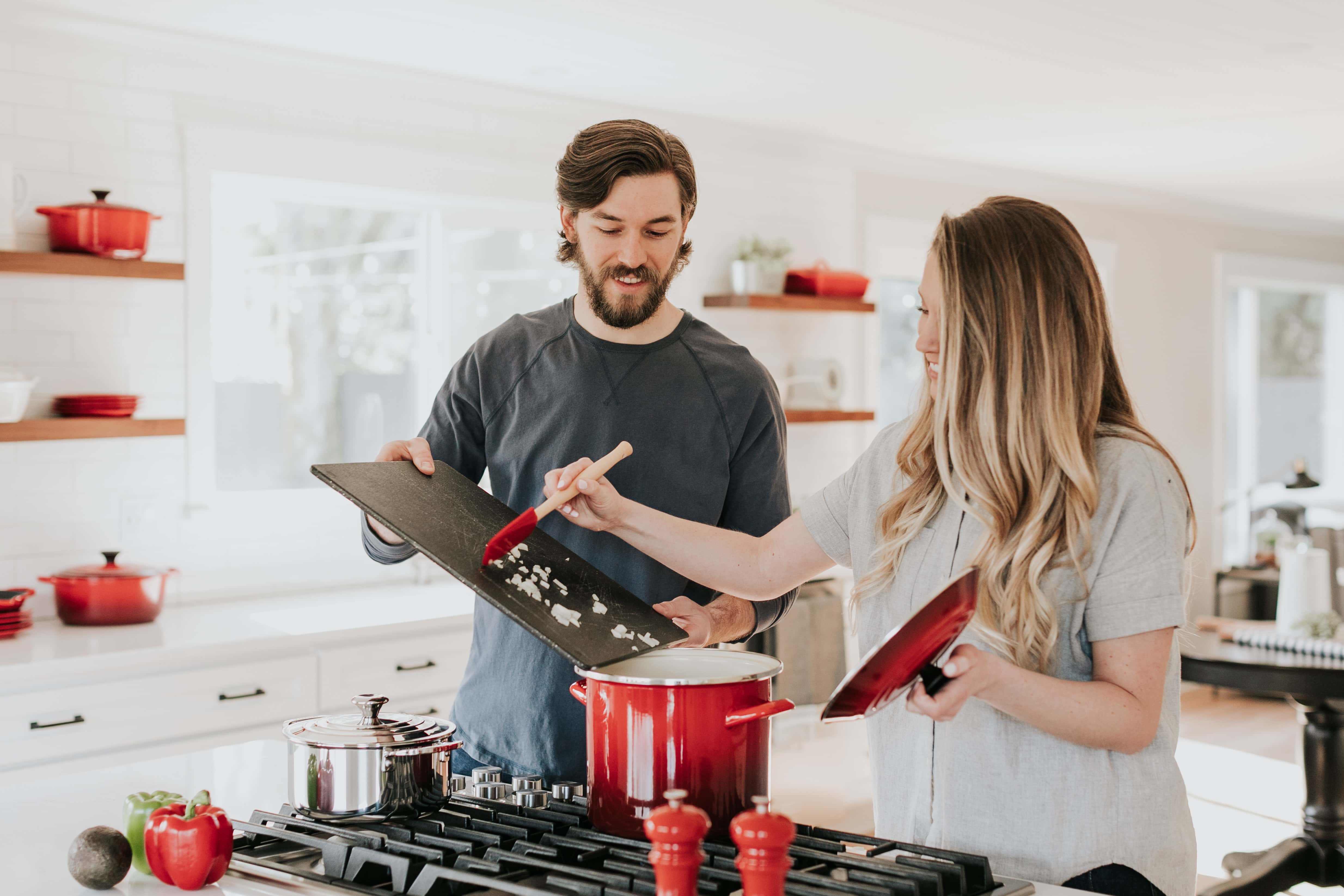 Real Estate Marketing Video Best Practices - An Image of a Couple Cooking in a new Home