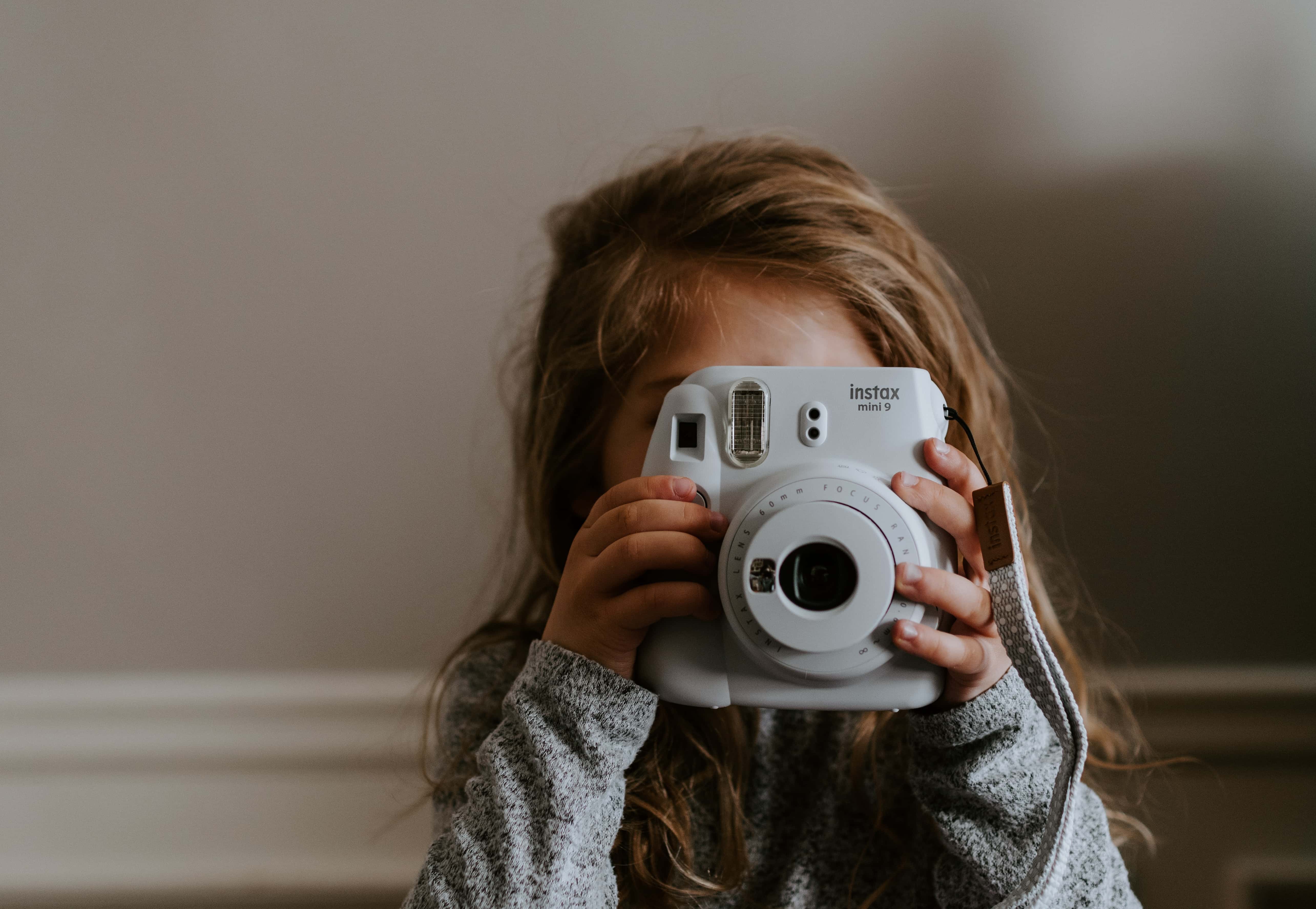 Filmmaking Trends in 2020 - An Image of a Young Child Holding a Camera