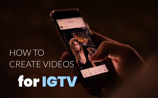 How to Create Videos for IGTV - Man holds smartphone with Instagram app