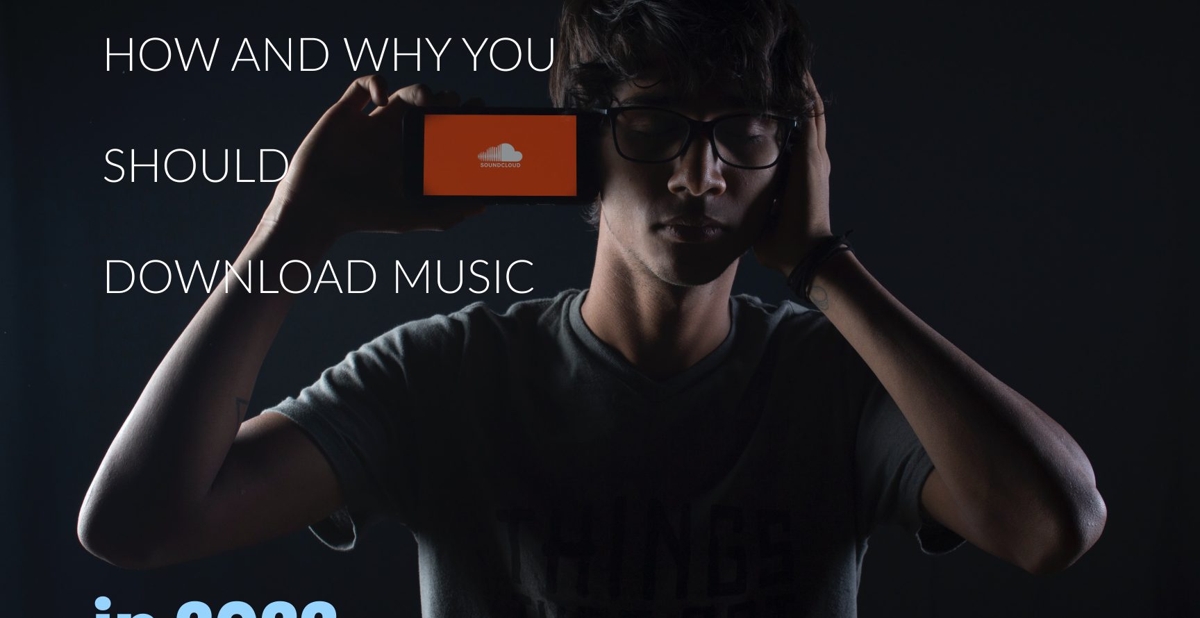 How-And-Why-You-Should-Download-Music-In-2022-young-man-listening-to-SoundCloud