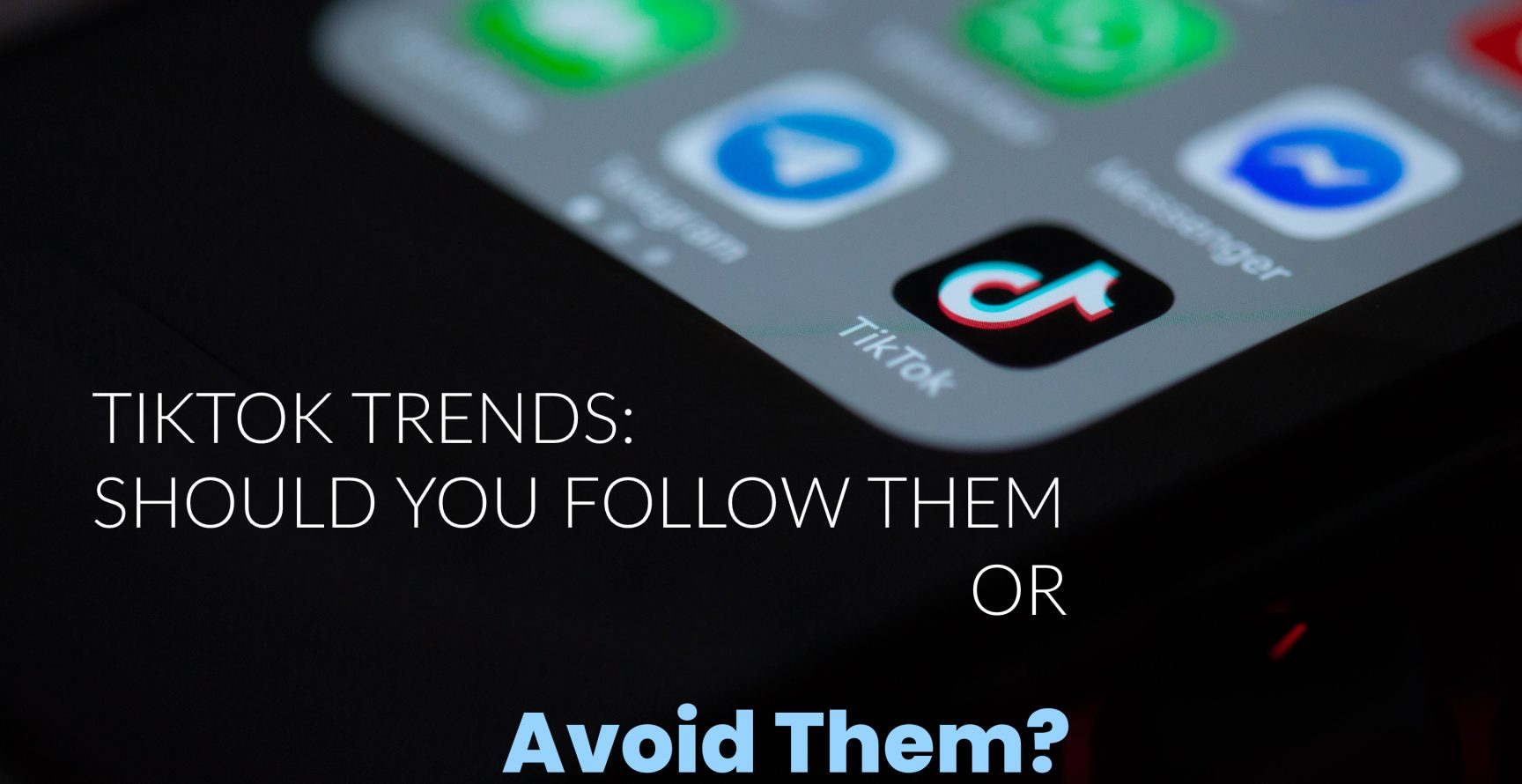 TikTok-Trends-Should-You-Follow-Them-Or-Avoid-Them-Phone-with-TikTok-App-Icon