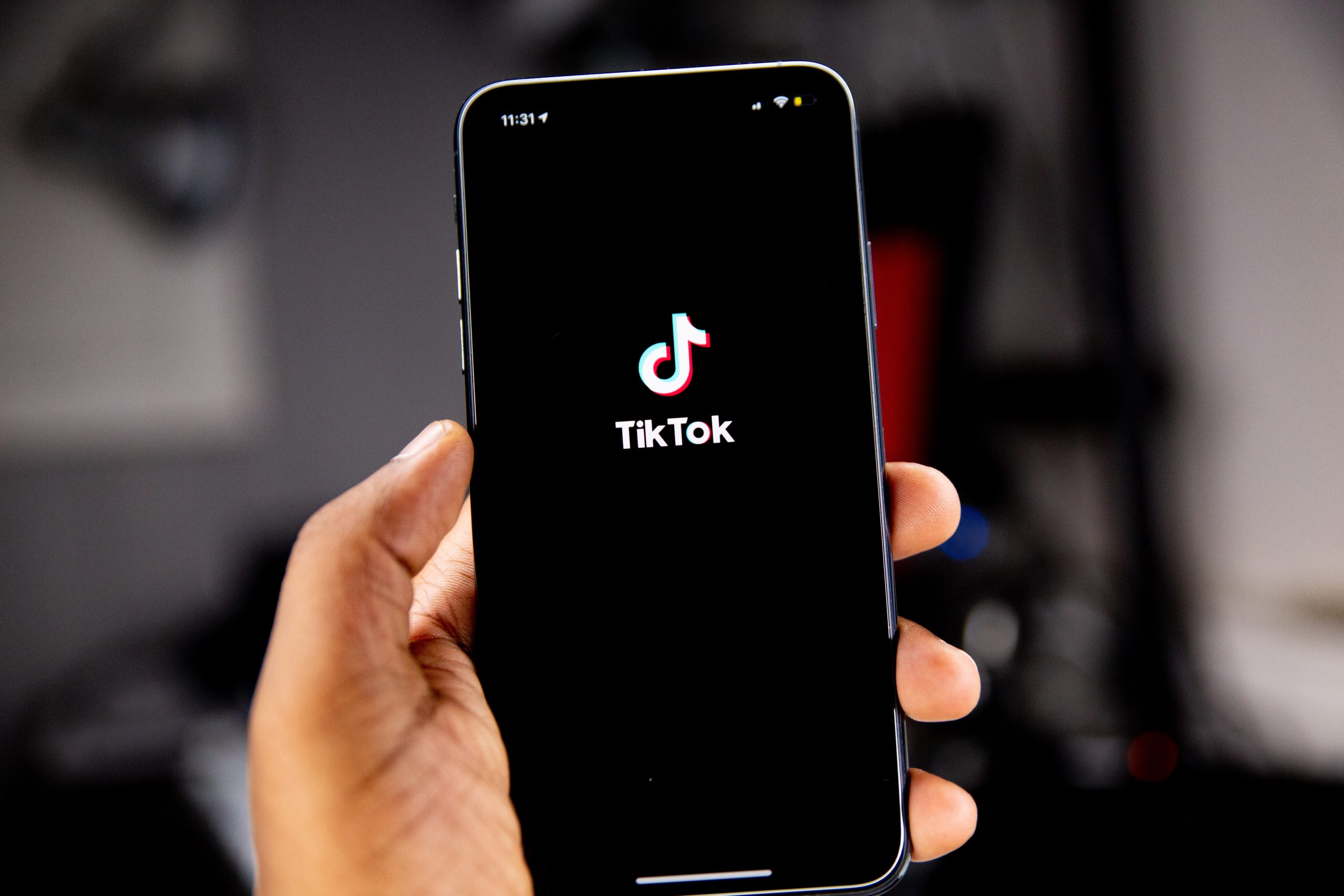 TikTok Trends - An image of a smartphone showing the TikTok logo.